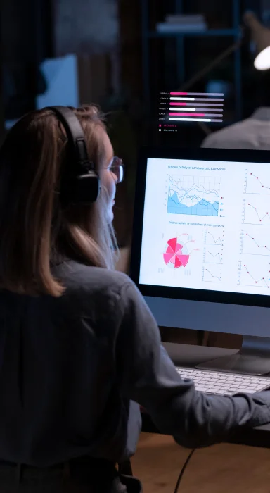 Illustration of a computer screen with data analysis, graphs, charts, documents, and a magnifying glass.