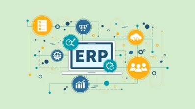 A man in a suit gesturing toward the details on a large, stylized identification card.