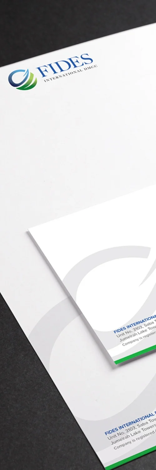 Hand writing in an open notebook under a lightbulb, symbolizing creative services by a creative services company for rebranding and brand refresh on the Rebranding & Brand Refresh page