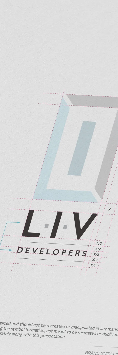 Hands designing text on a tablet, symbolizing the creation of brand identity through creative services on the Brand Guidelines page