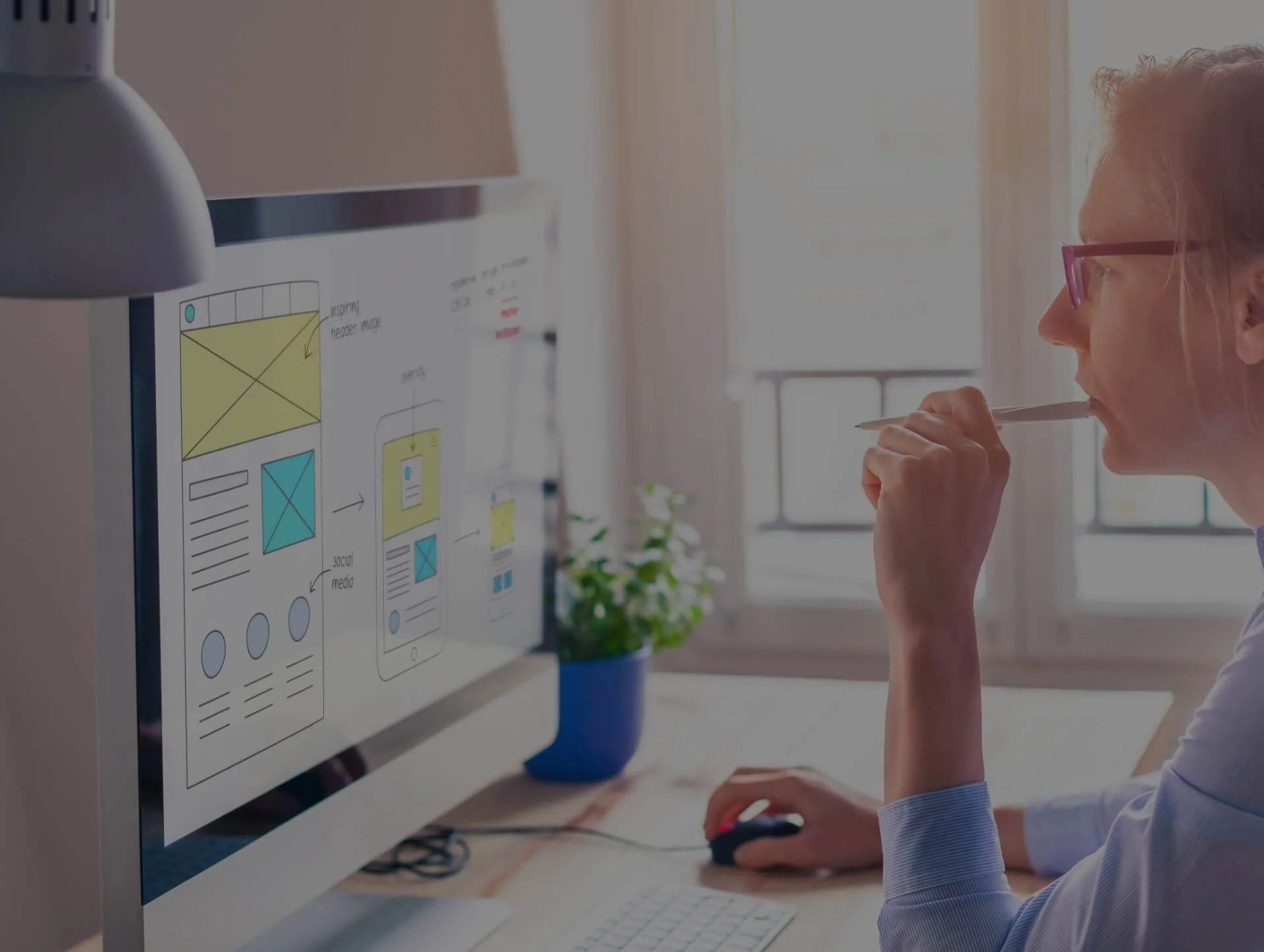 Designer working on wireframes for a progressive web application, showcasing web design and development solutions for seamless user experiences