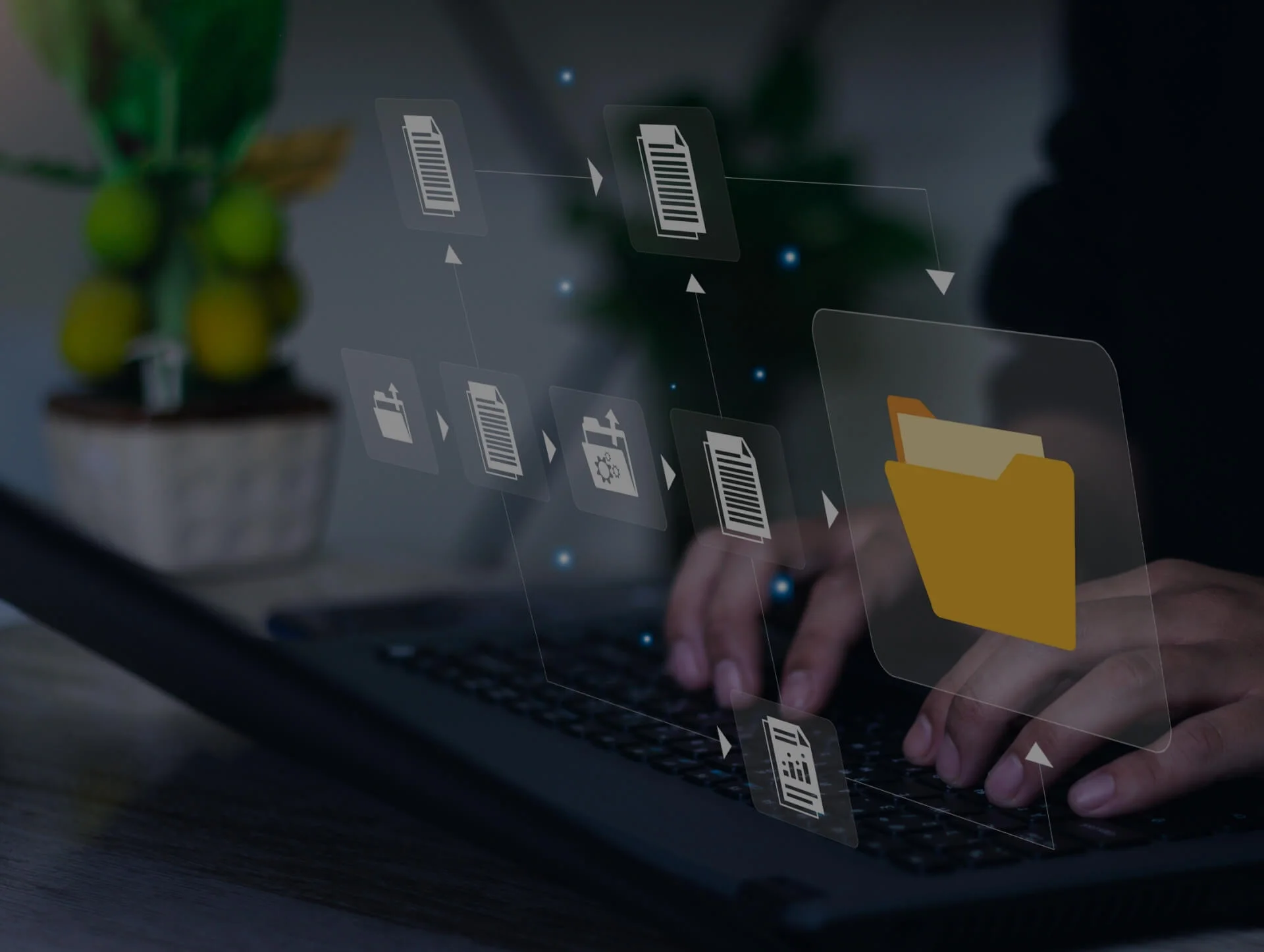 A person using a laptop with digital icons representing file management, symbolizing PIM Implementation Services and Pimcore digital asset management